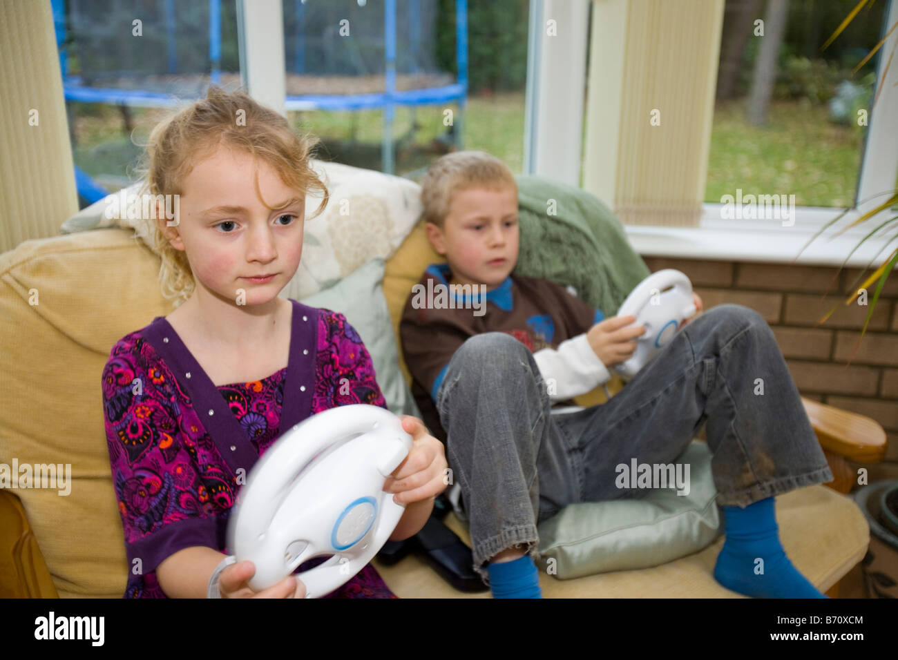 A family playing computer games on a Wii console Stock Photo Alamy