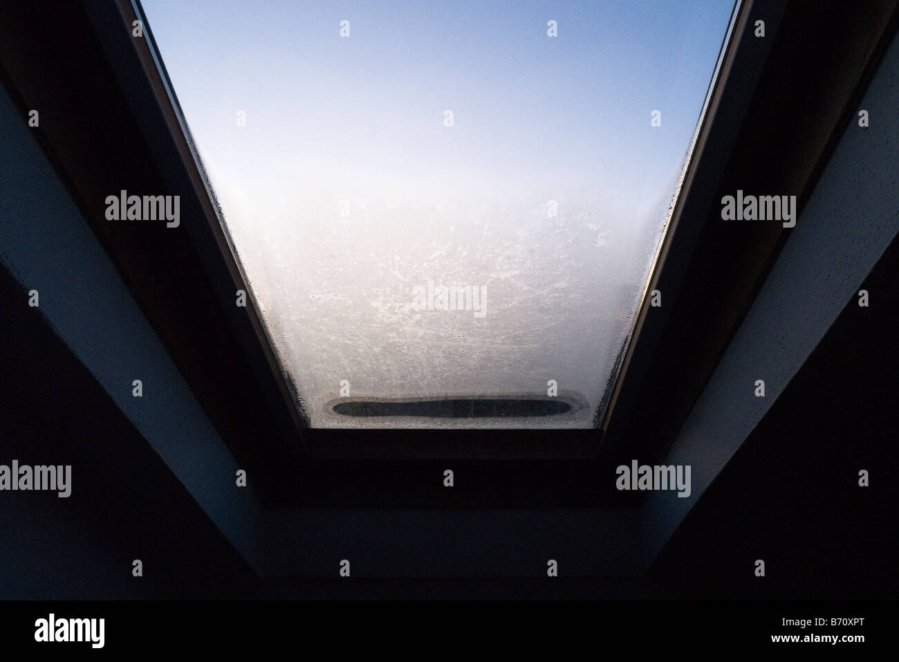 Looking up through skylight on a cold morning Stock Photo