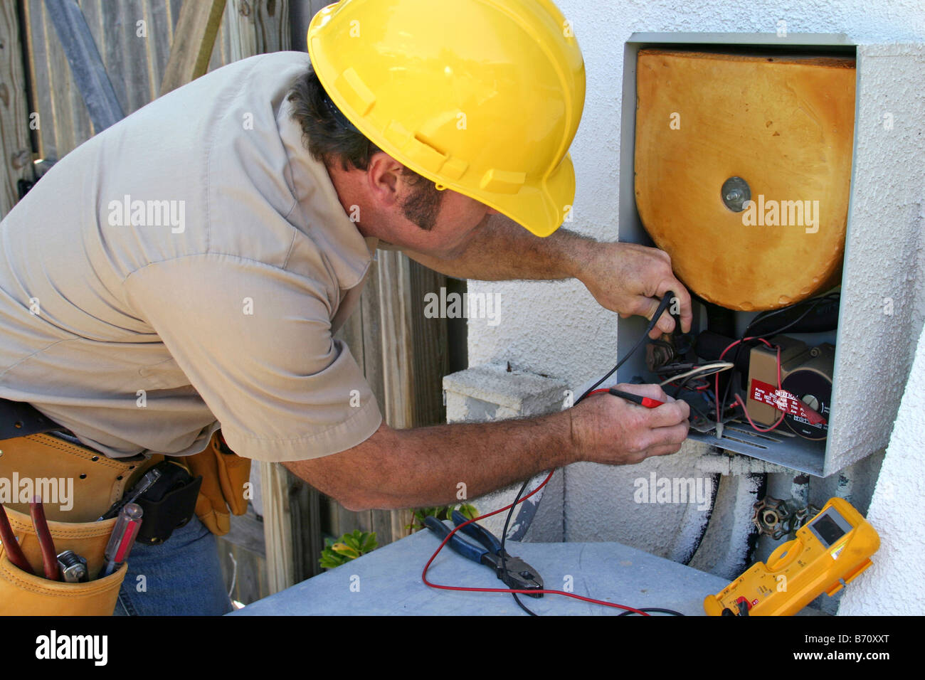 An air conditioning tech working on a heat recovery unit Stock Photo