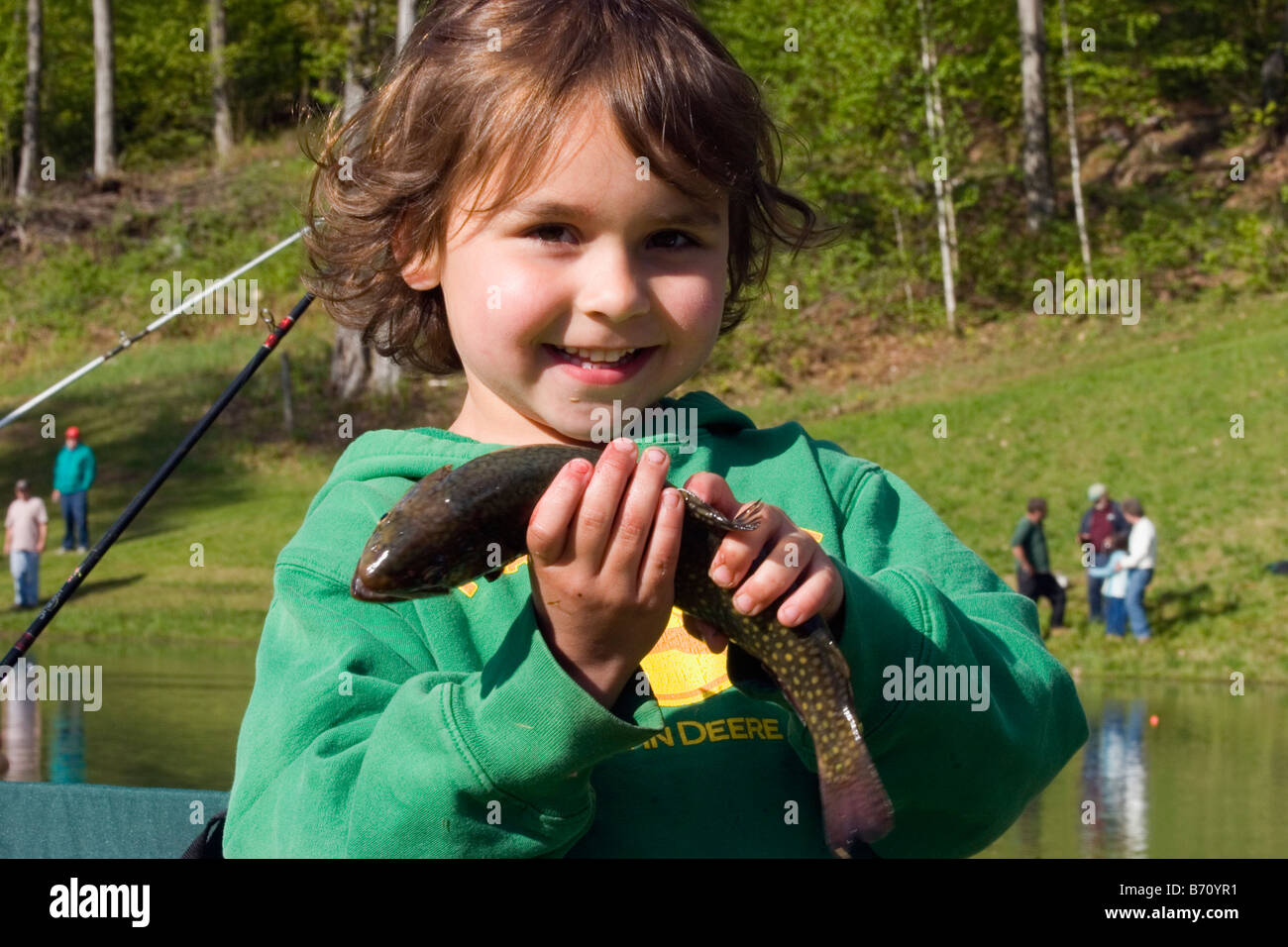 Little girl fishing in pond hi-res stock photography and images - Alamy