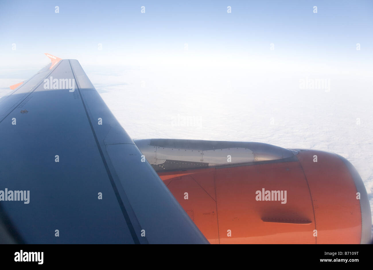 Aeroplane wing above the clouds Stock Photo - Alamy