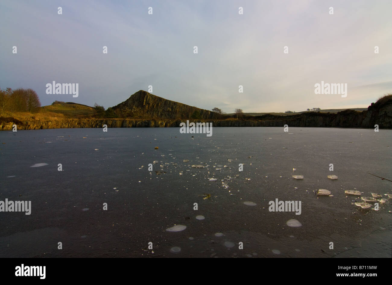 Frozen pond at Cawfields quarry on the roman wall northumberland Stock