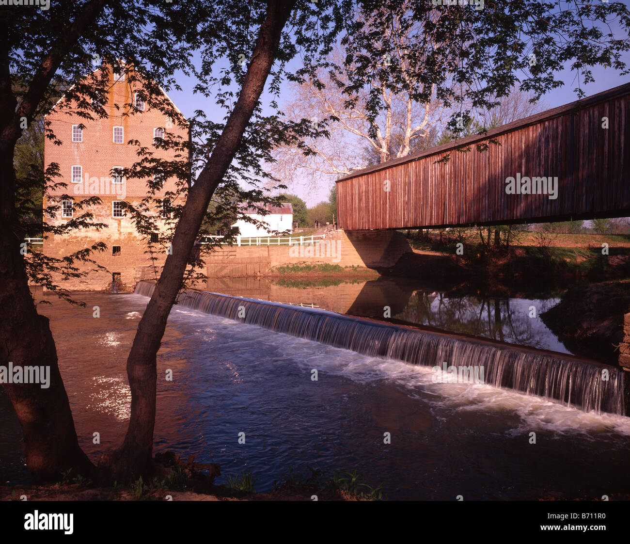 Old Mill with Covered Bridge Stock Photo Alamy