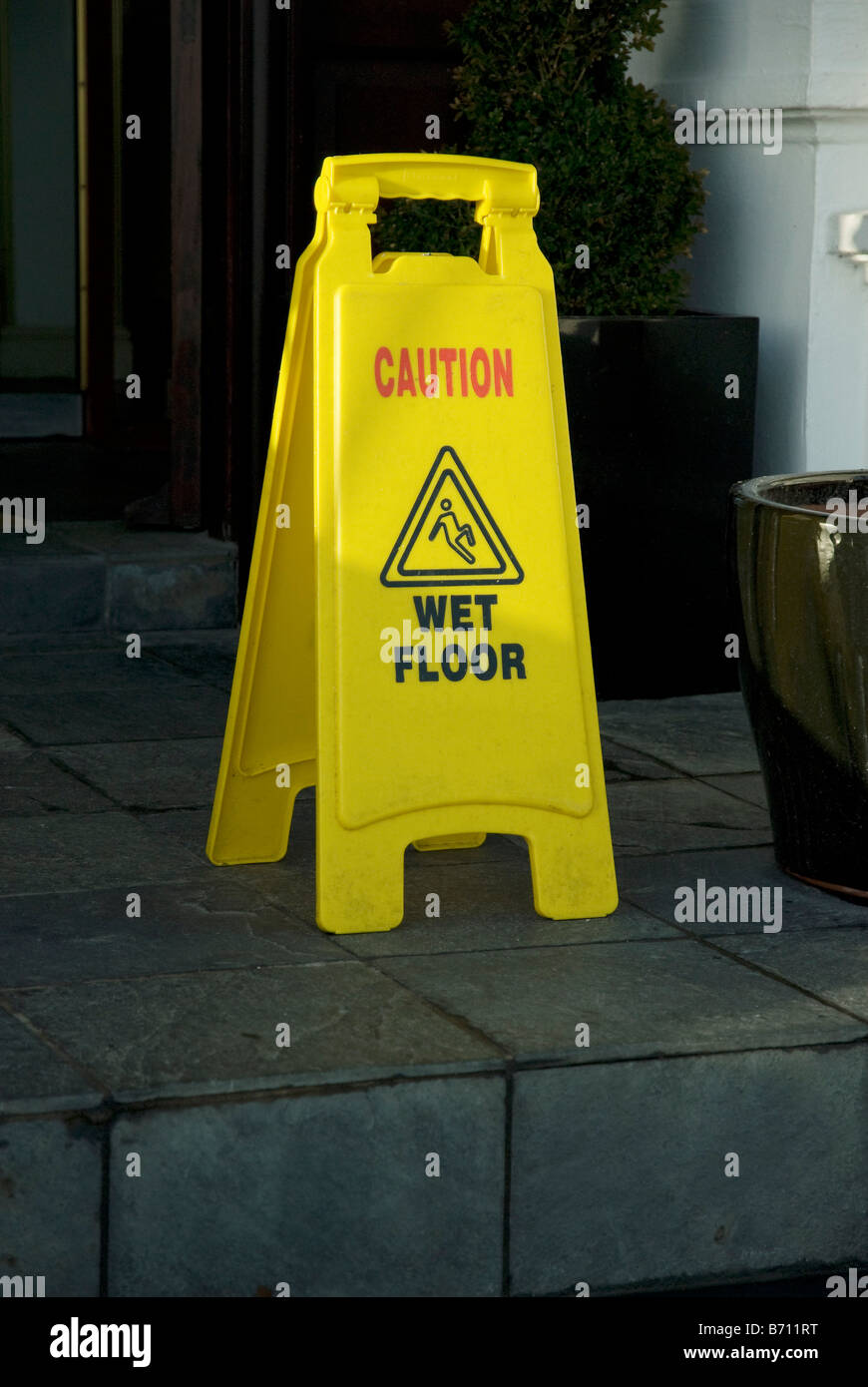 Wet floor sign on a step Stock Photo