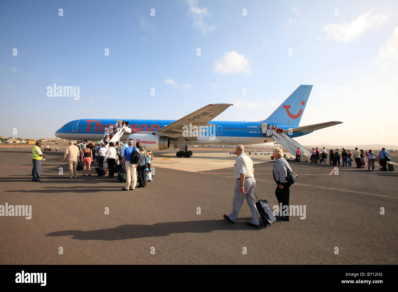 cape verde islands boa vista airport passengers boarding a thomson charter jet Stock Photo