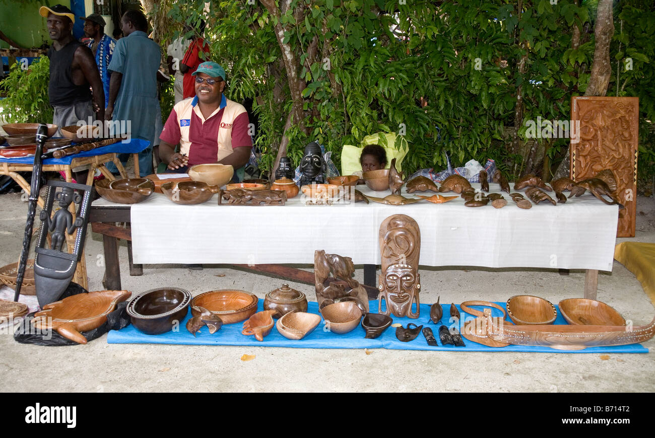 Solomon Island people offering their wooden carvings for sale at Uepi Island Resort, Solomon Islands Stock Photo
