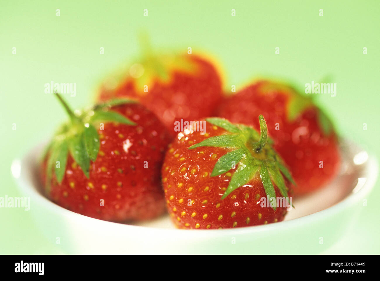 strawberry strawberries laying on a plate Fragaria Stock Photo