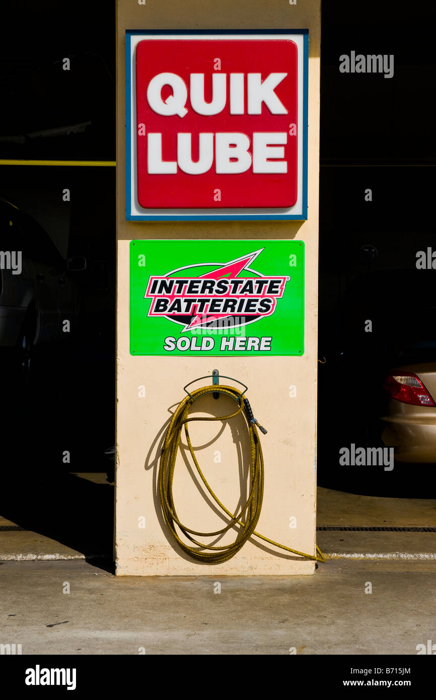 Interesting signs outside service station garage, QUIK LUBE, interstate