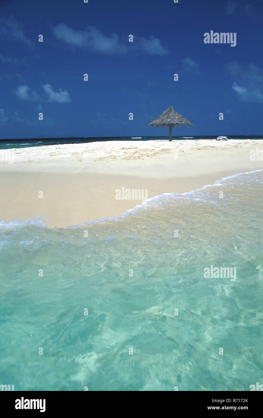 Sandbar in the Grenadines, thatch umbrella Stock Photo Alamy