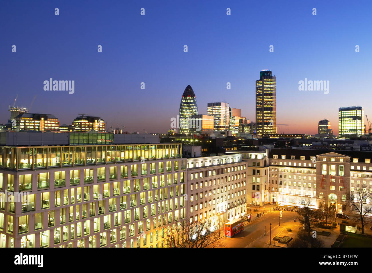Night shot of Nat West Tower Gherkin and London skyline London England Stock Photo