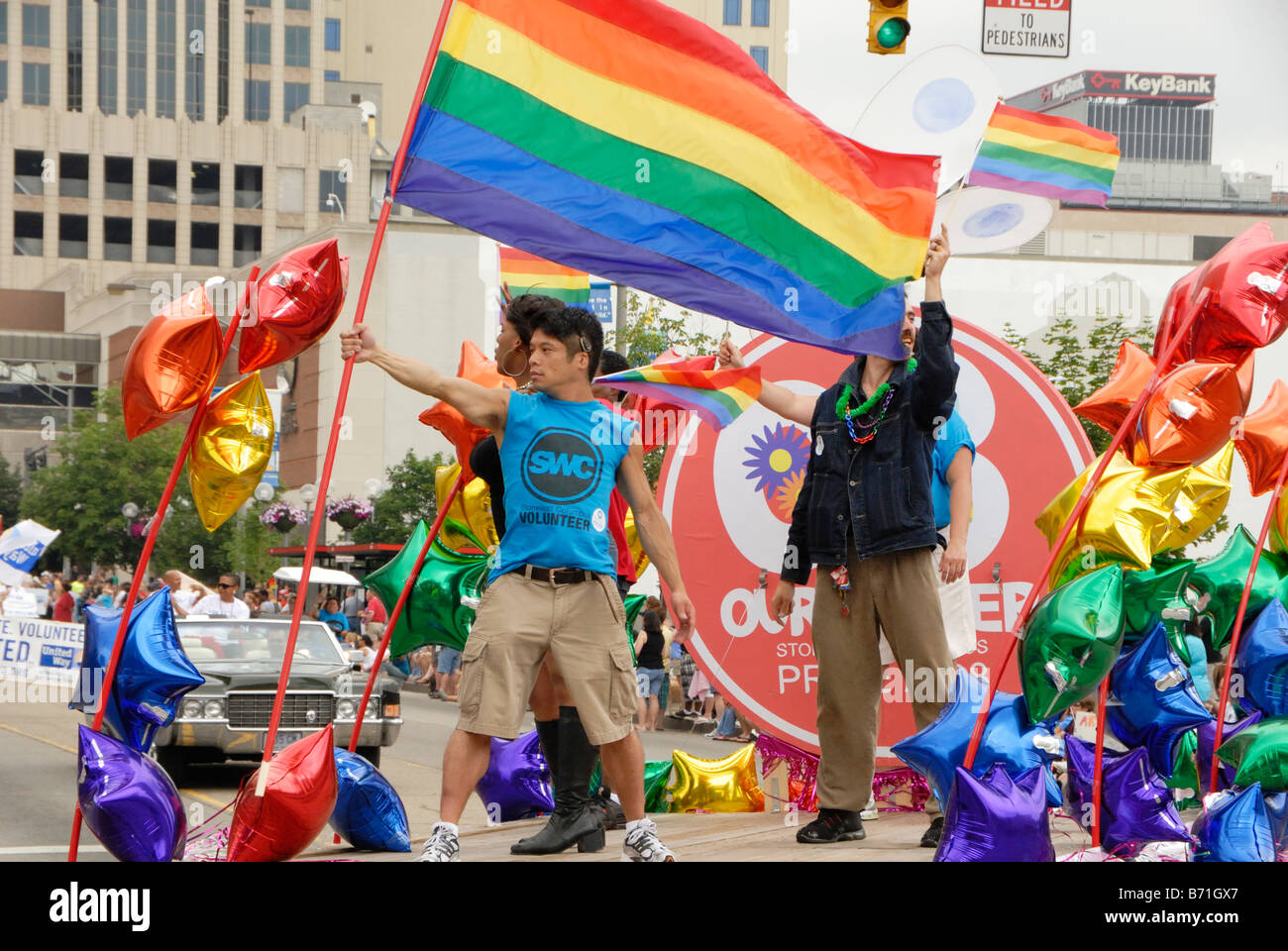 Young man proudly holds rainbow flag in Gay Pride Parade Columbus Ohio 2008 Stock Photo