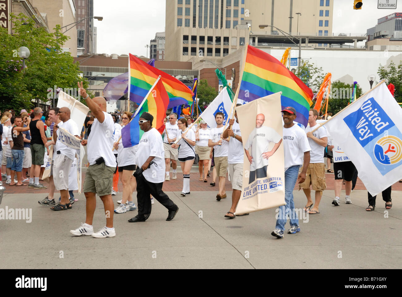 united way marchers carrying rainbow flags and signs in Gay Pride Parade Columbus Ohio 2008 Stock Photo