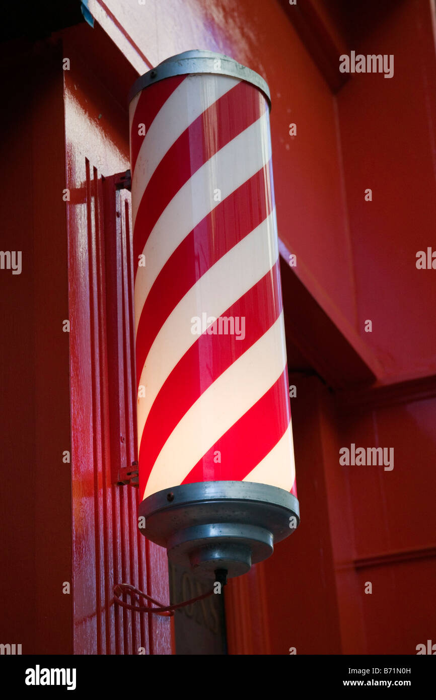 Traditional Barber Shop Red & White Pole in Cork, Ireland Stock Photo