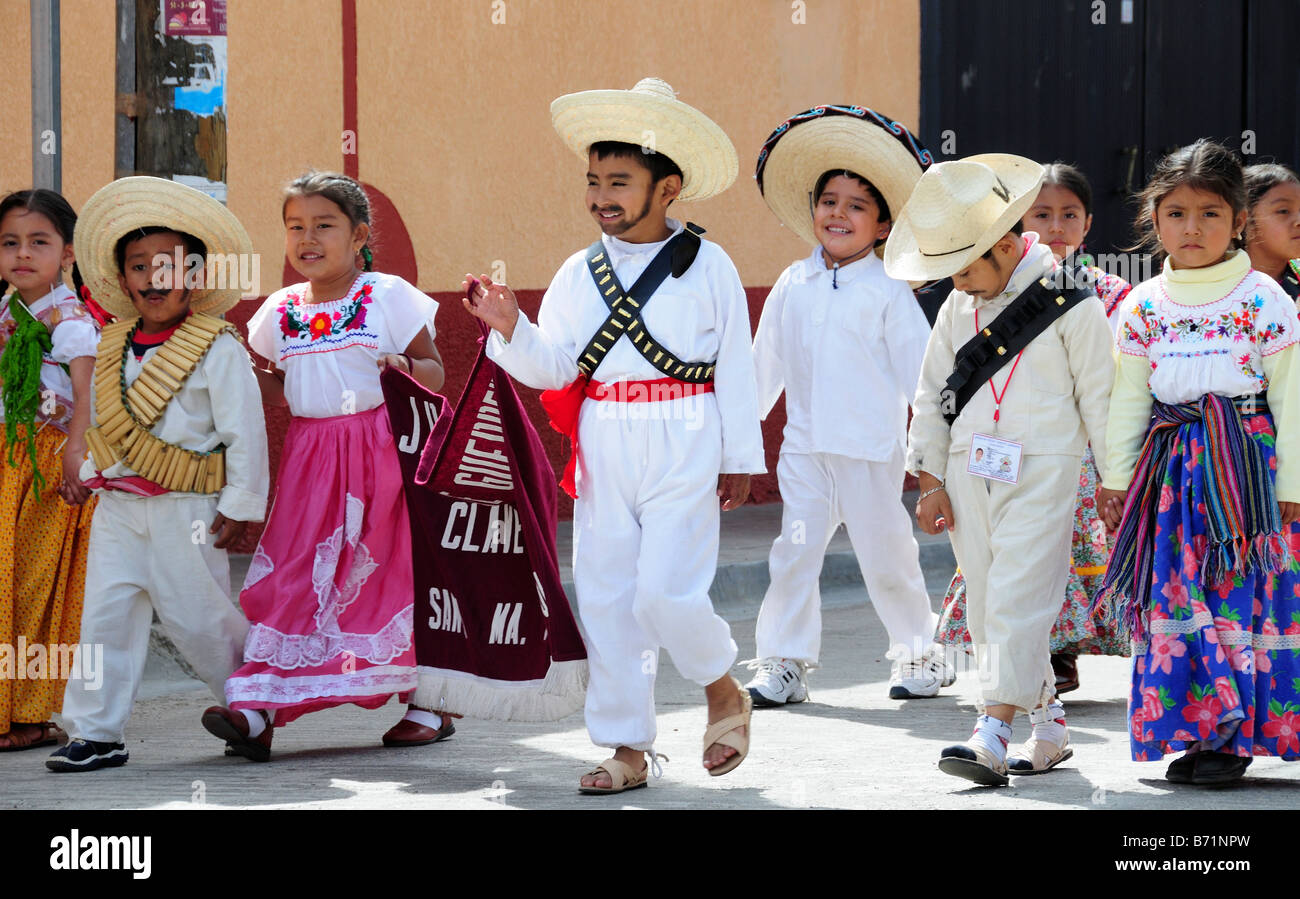 Mexican children in national costume parading on Anniversary of the Revolution Stock Photo