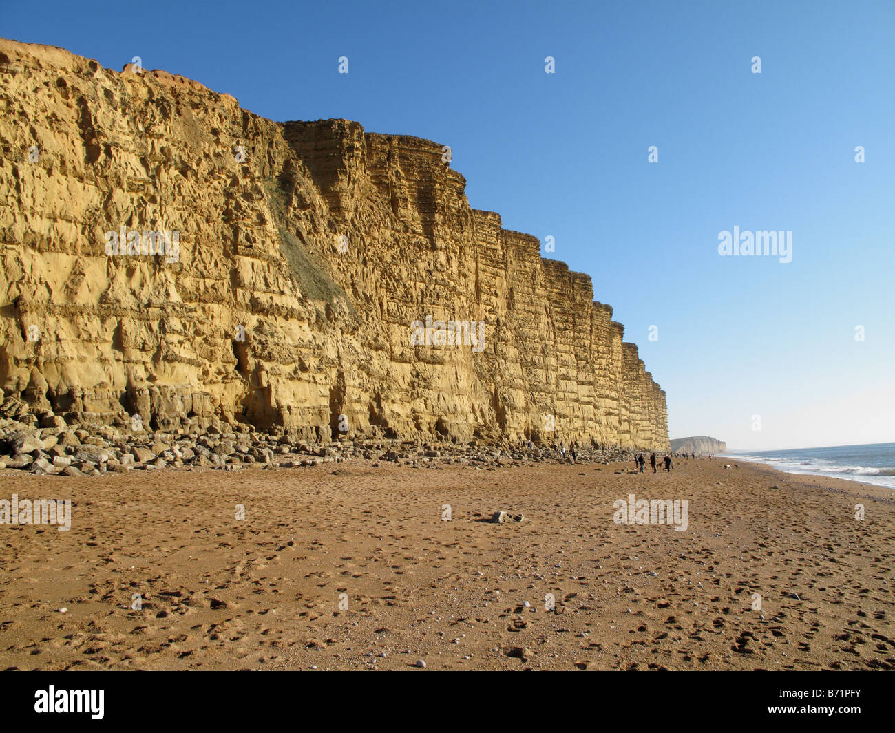 Beach and sandstone of East Cliff at West Bay near Bridport on the Jurassic Coast of Dorset Stock Photo