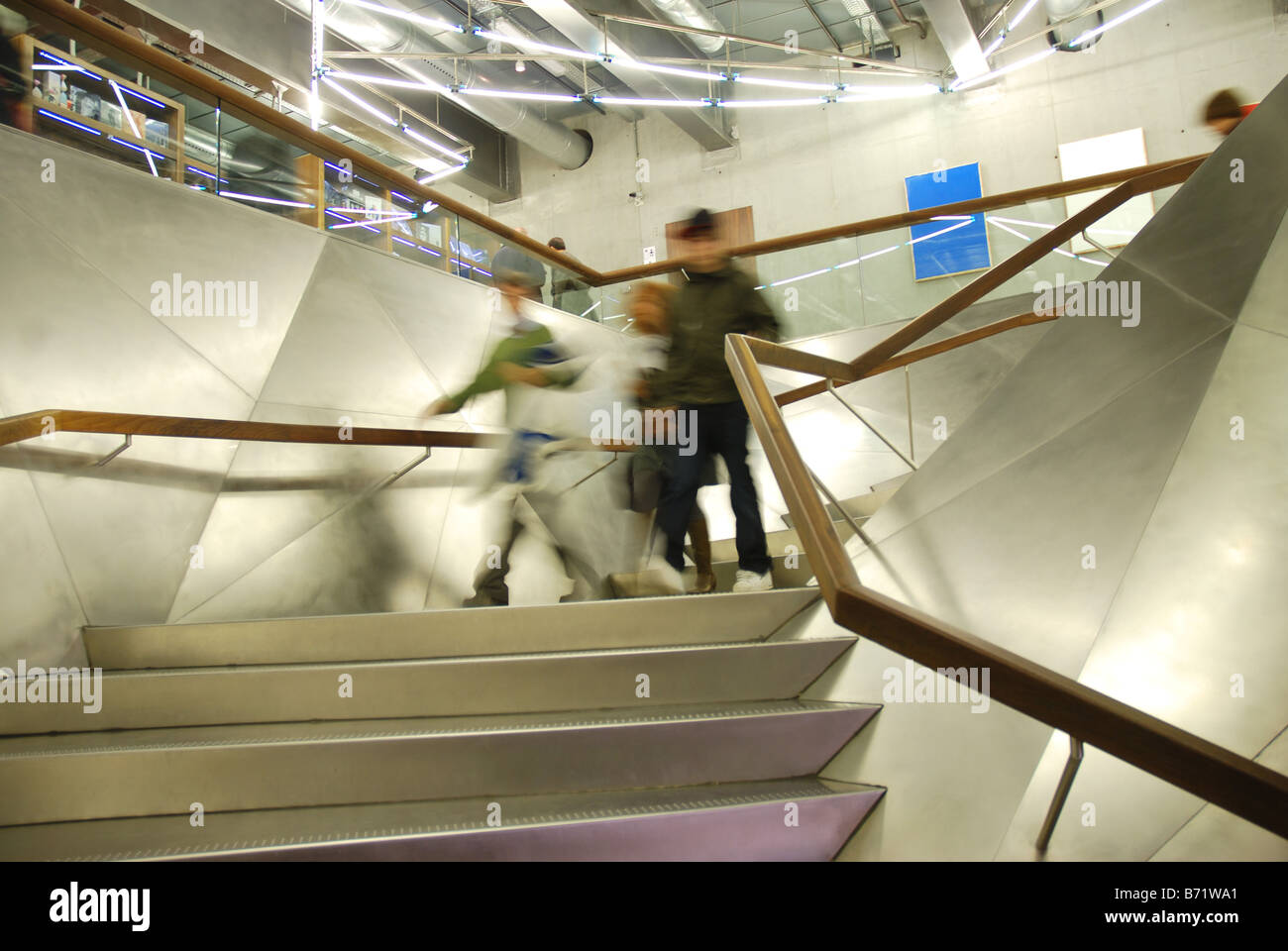 People coming down the stairs. Caixaforum Art Centre. Madrid. Spain. Stock Photo