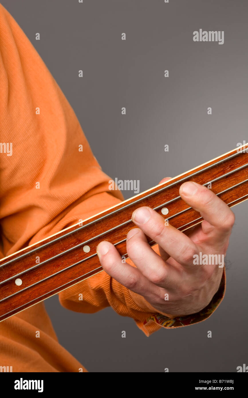 Close up of fretless bass players left hand Stock Photo