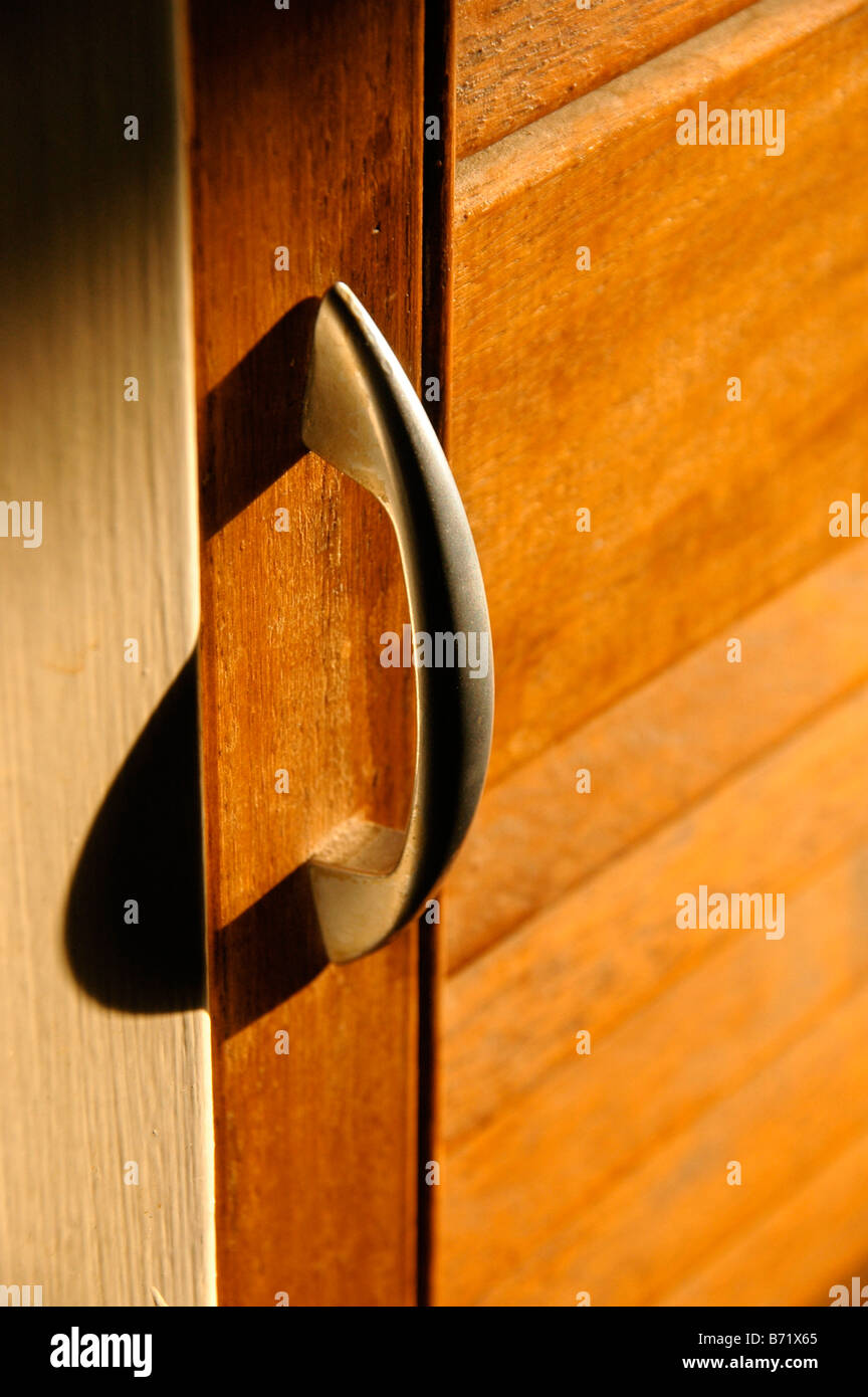 A door handle to an airing cupboard. Stock Photo