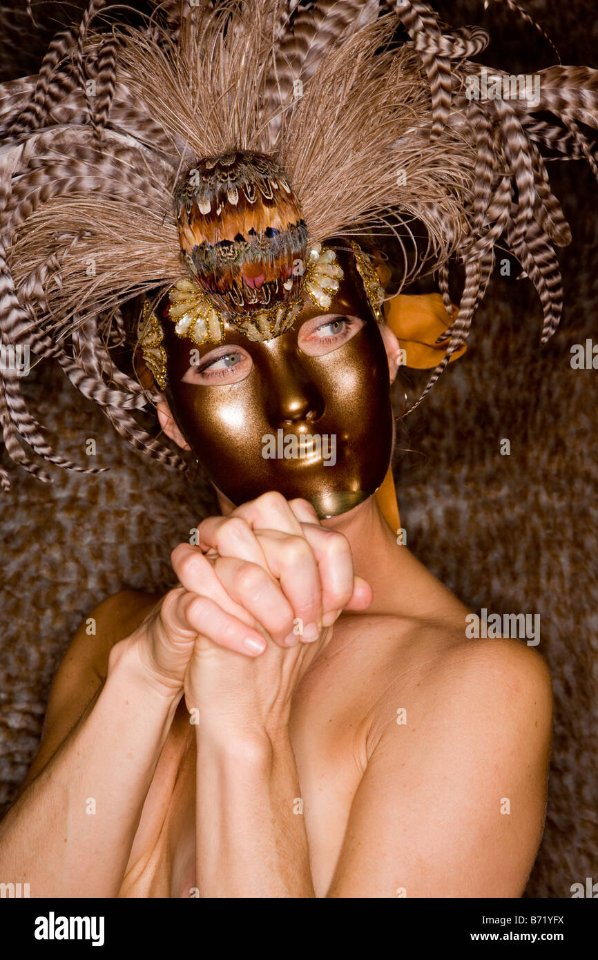 Nude woman wearing masquerade mask Stock Photo - Alamy