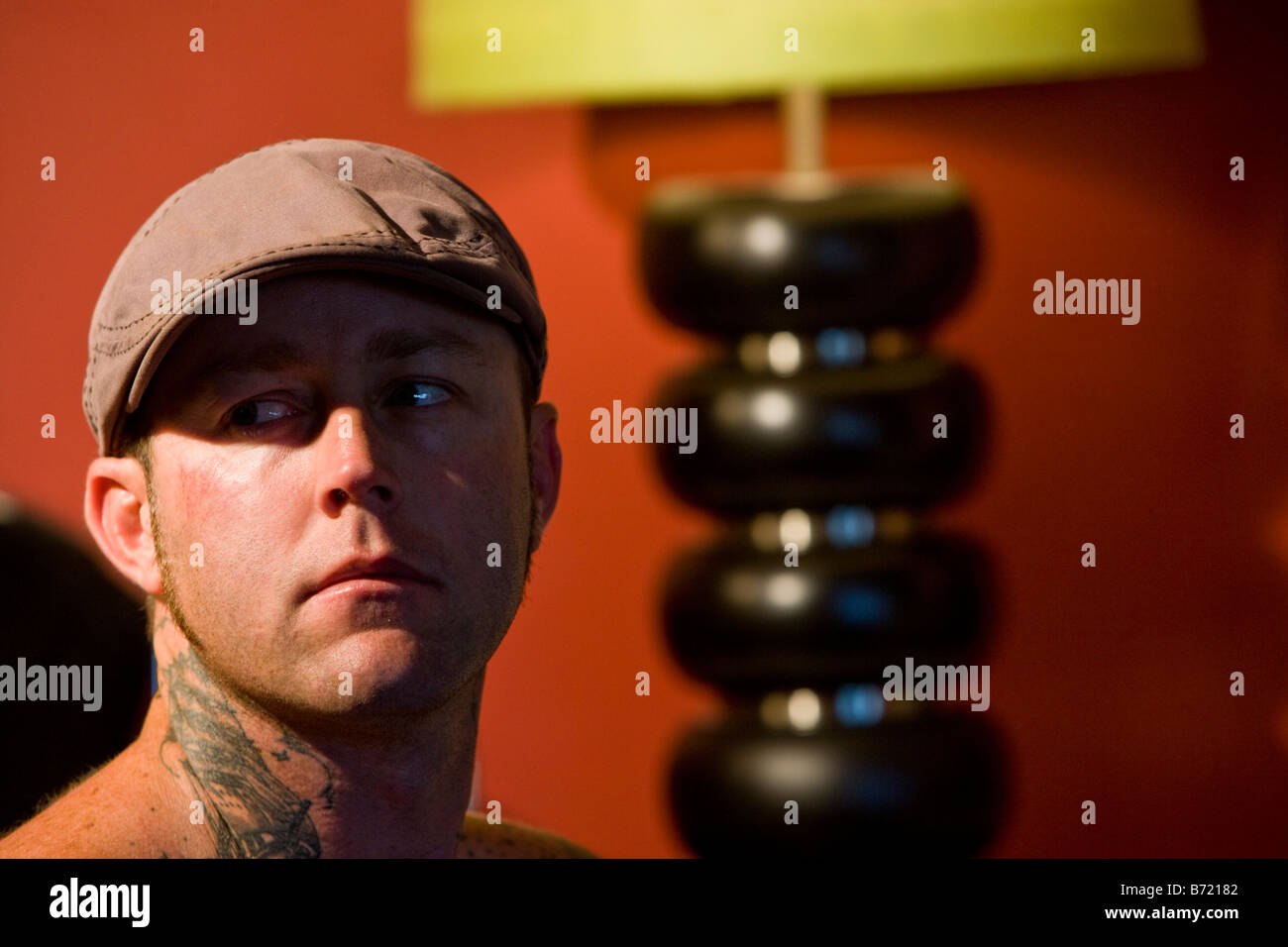 Headshot of young man with tattoo design on neck Stock Photo