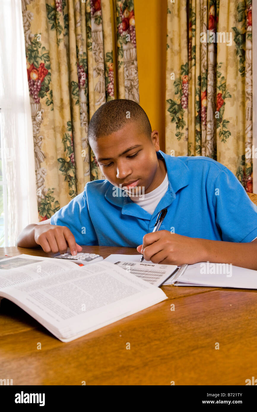 African-American teenager doing homework Stock Photo - Alamy