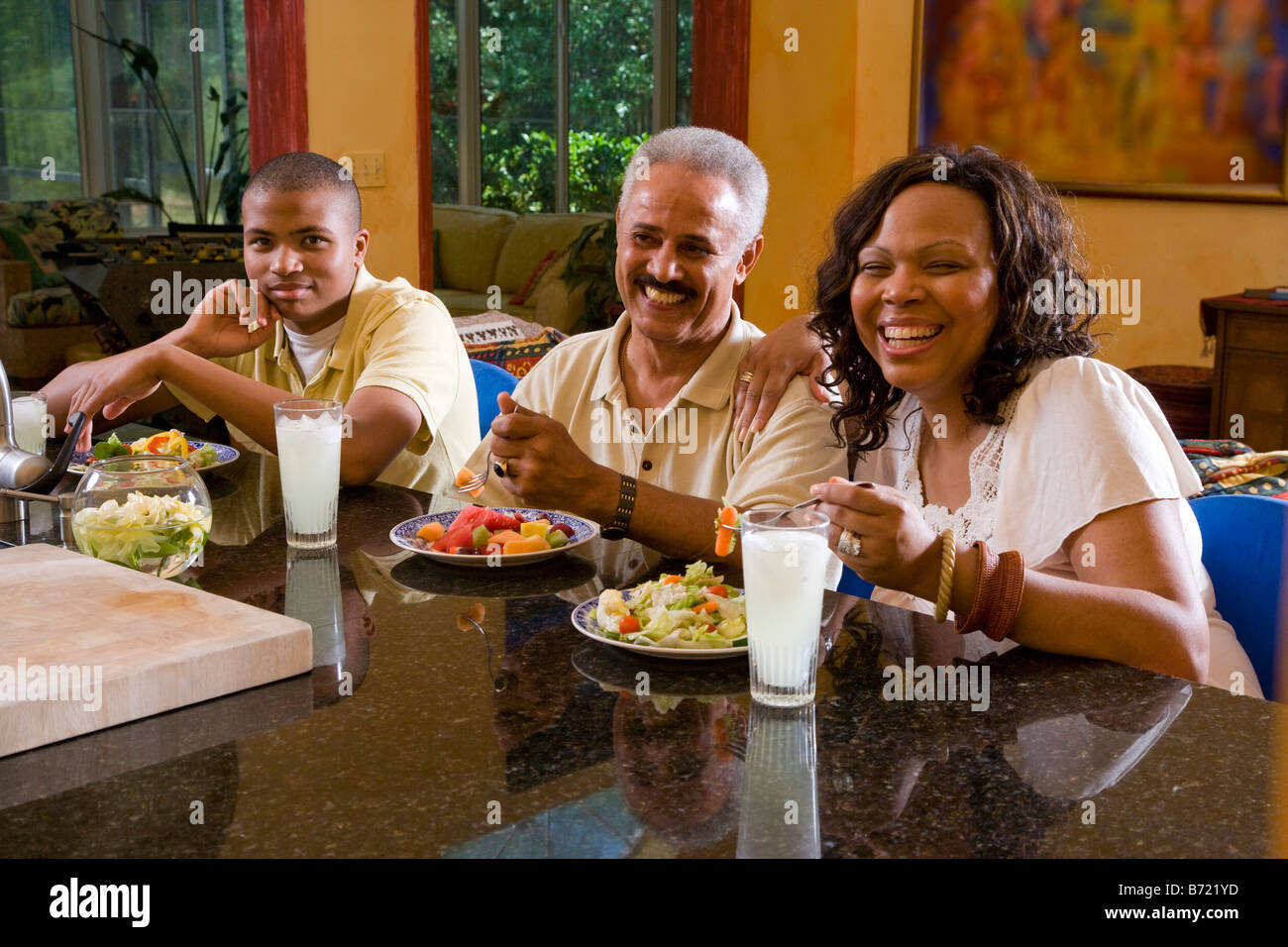 African American family eating healthy meal Stock Photo - Alamy