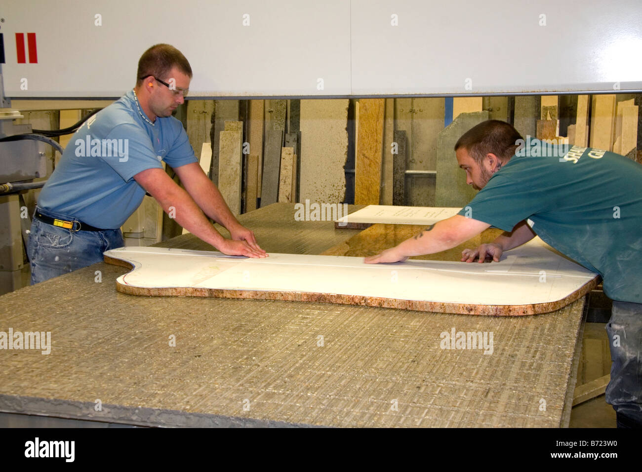 Workers Custom Cutting A Granite Countertop At The Shaker Hill