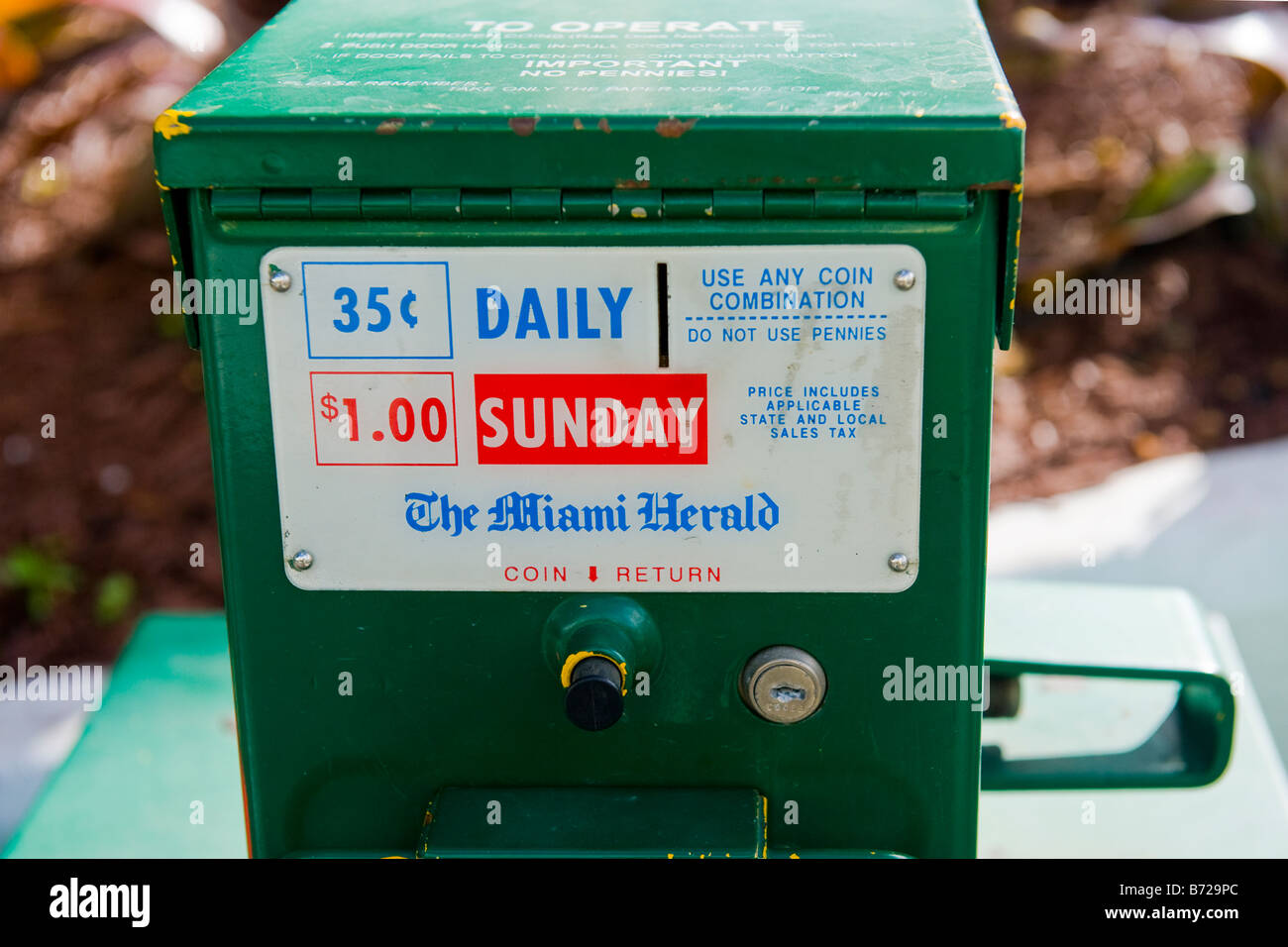 Miami street or road scene , newspaper coin operated vending machine for The Miami Herald in