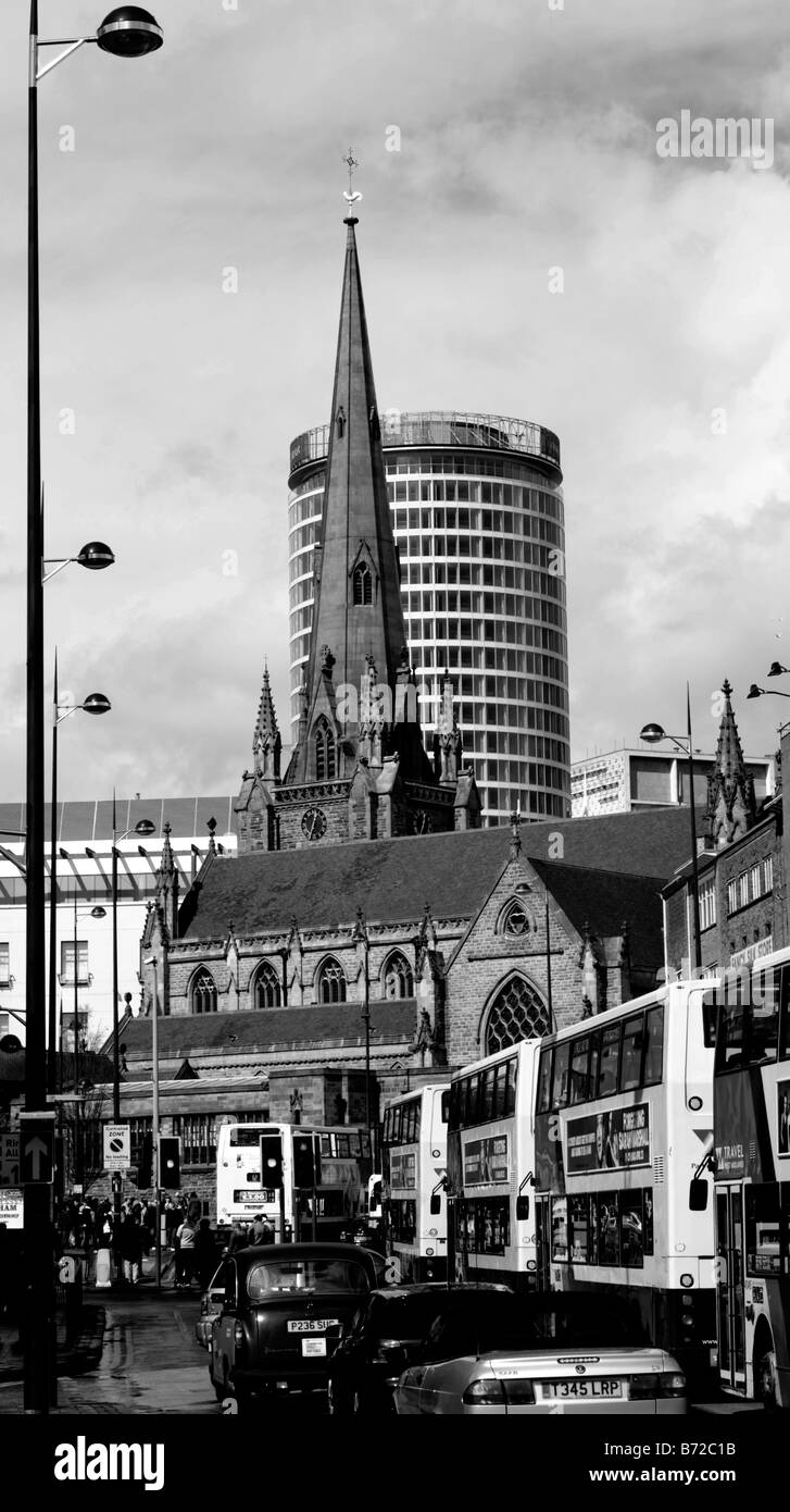 The church of St. Martin in the Bull Ring, Birmingham with The Rotunda behind it from the open air market. Stock Photo
