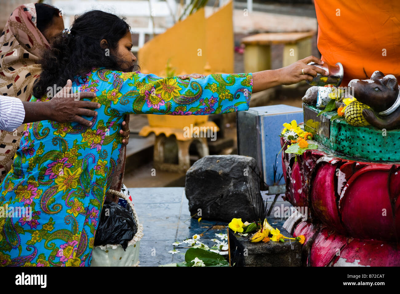 Woman praying at the Hindu temple at Grand Bassin Mauritius Stock Photo
