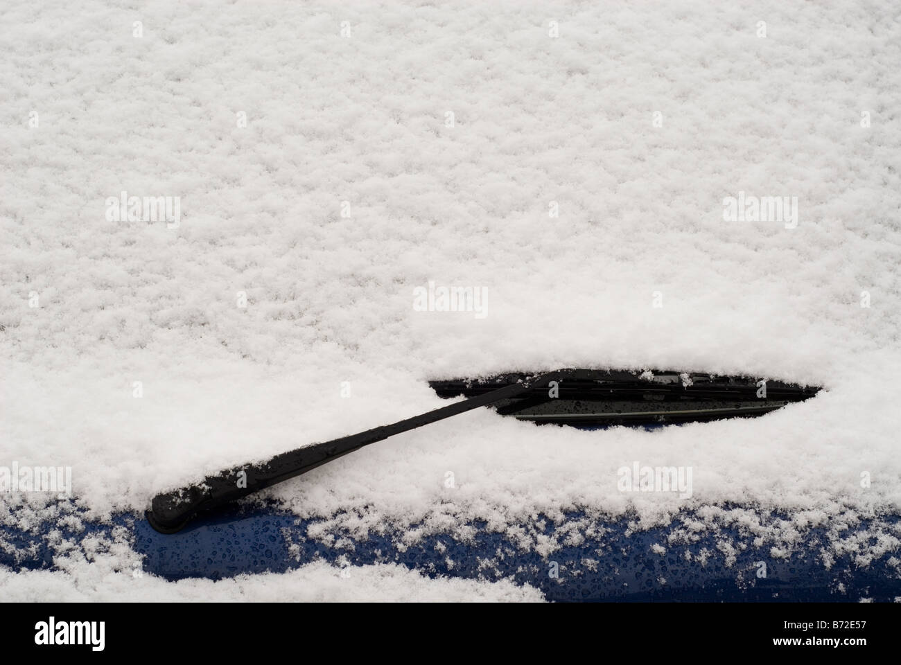 Snow covering windshield of a car Manchester UK Stock Photo