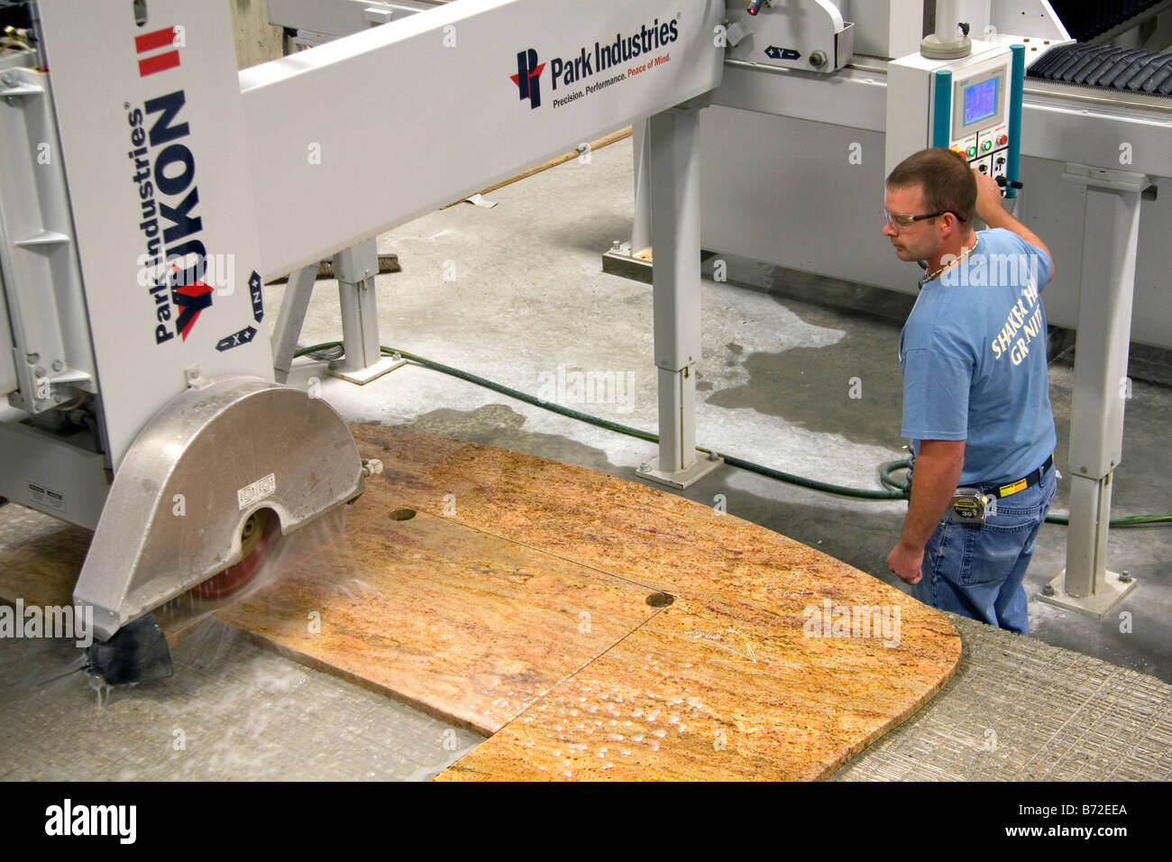 Worker Custom Cutting A Granite Countertop At The Shaker Hill
