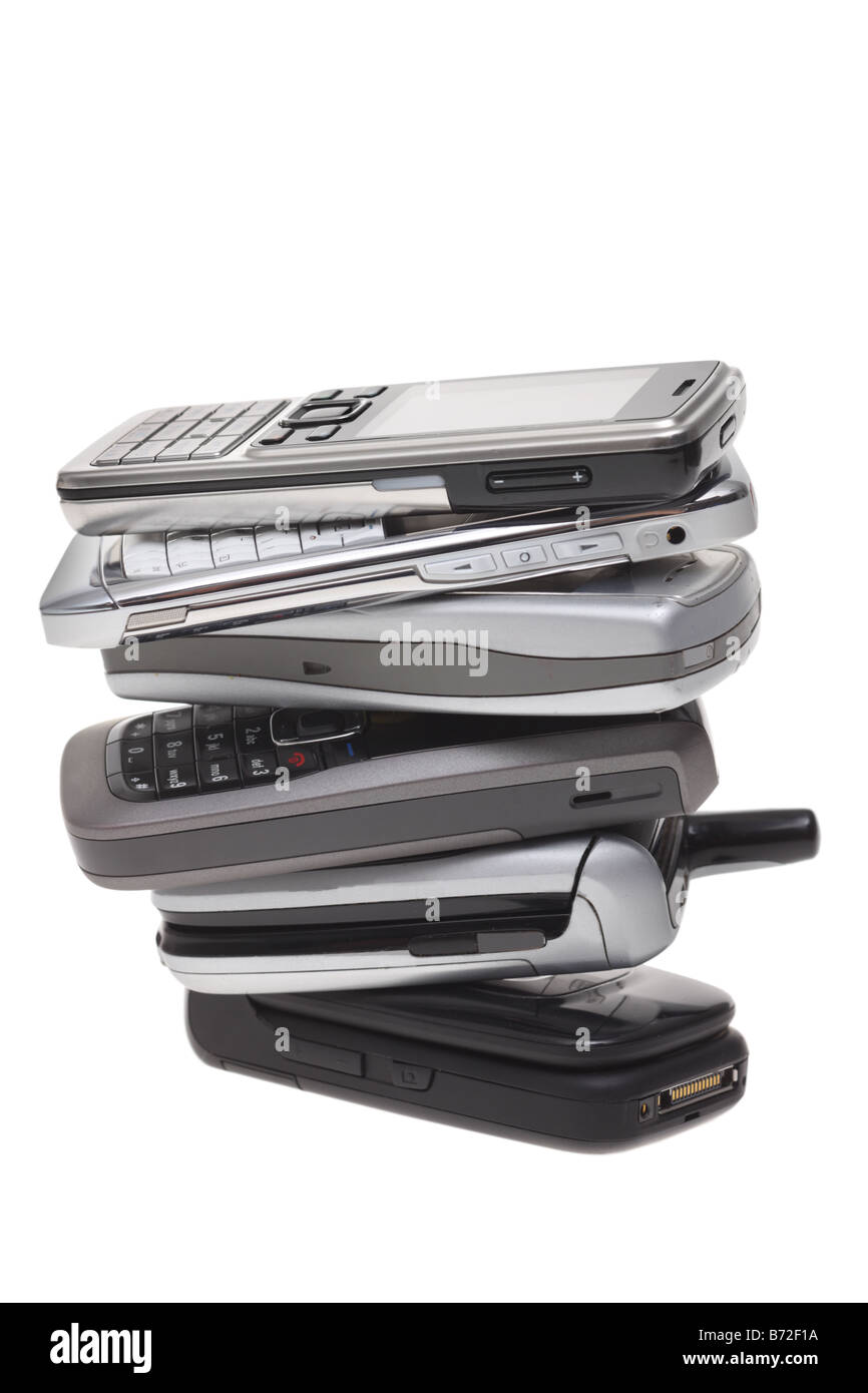 Stack of cell phones cut out on white background Stock Photo