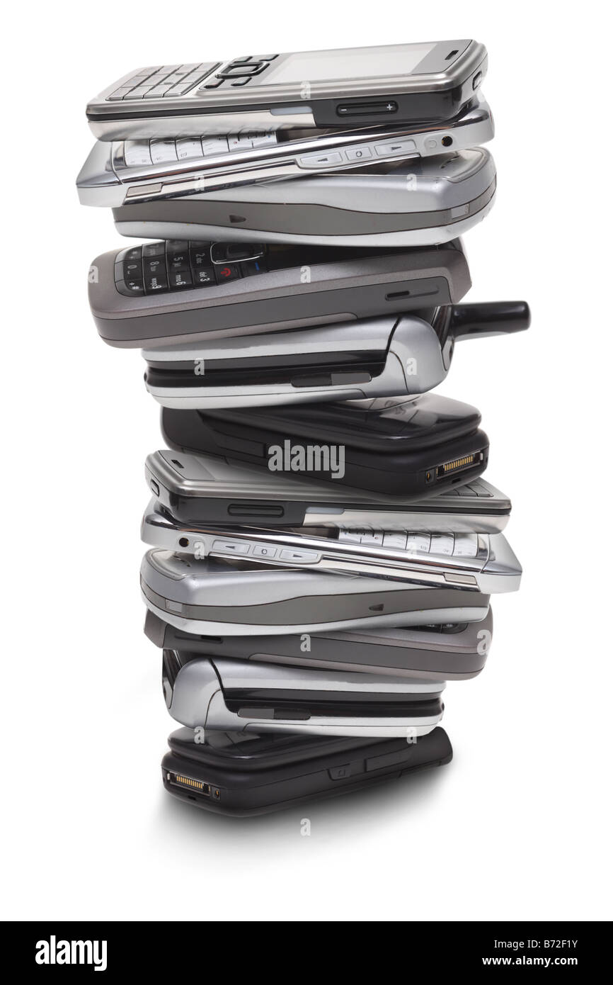 Stack of cell phones cut out on white background Stock Photo