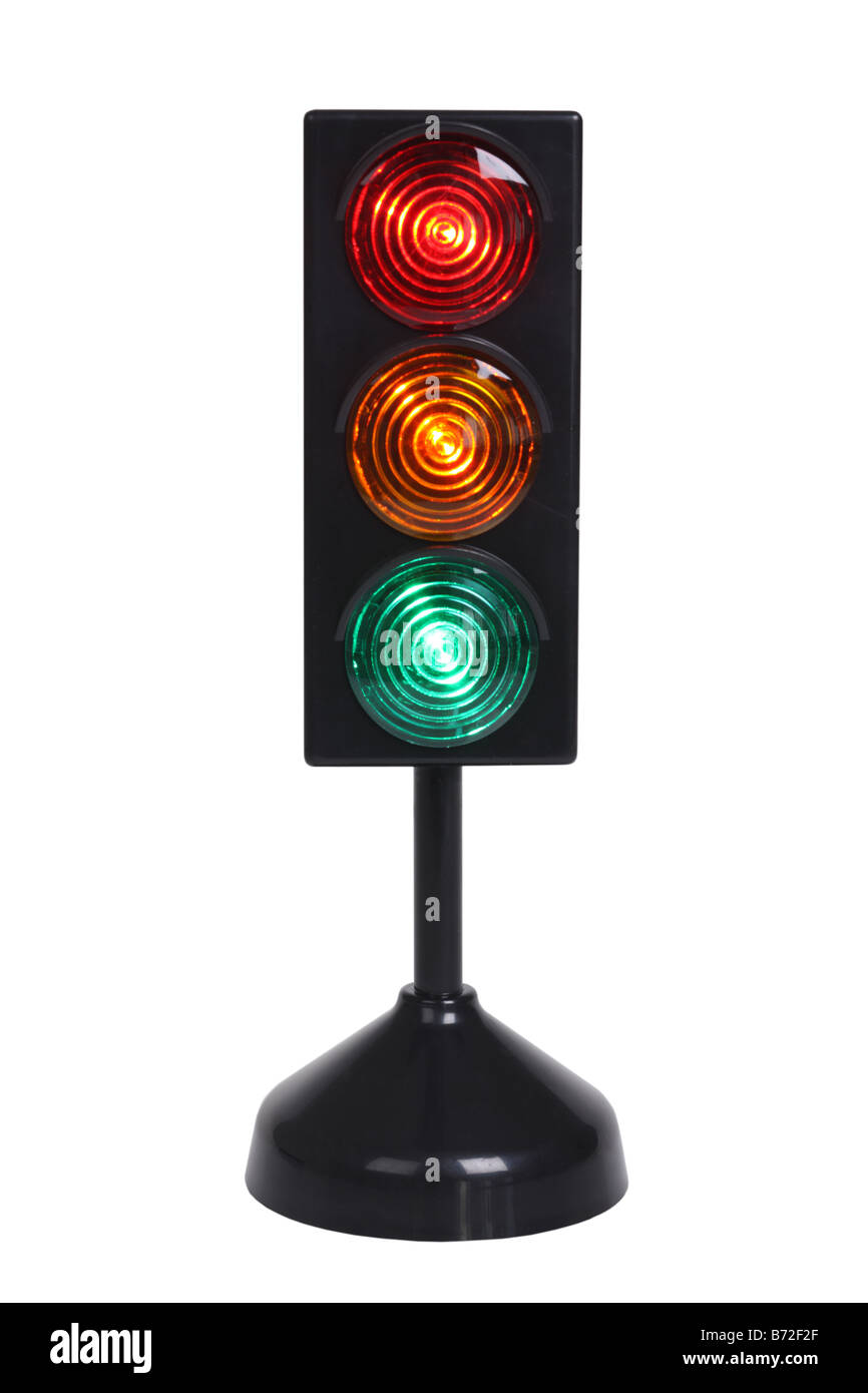 Small traffic light cut out on white background Stock Photo