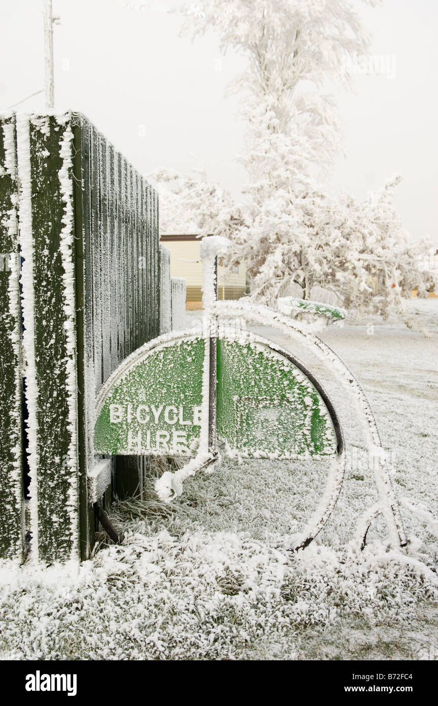 Frost covered penny farthing bicycle at bike hire centre,Findhorn,UK Stock Photo