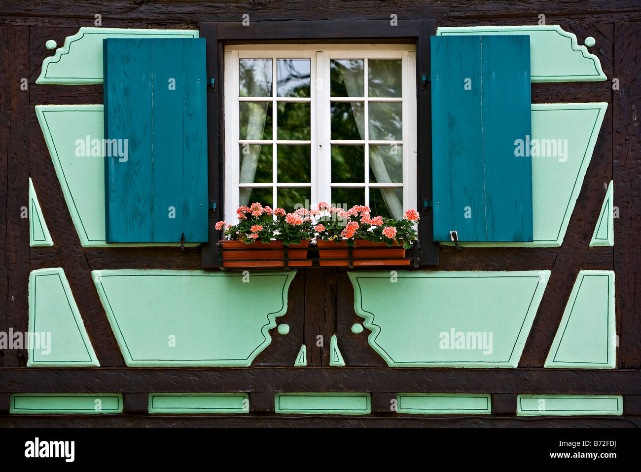 window, flowers and shutters Colmar France Alsace Europe Stock Photo