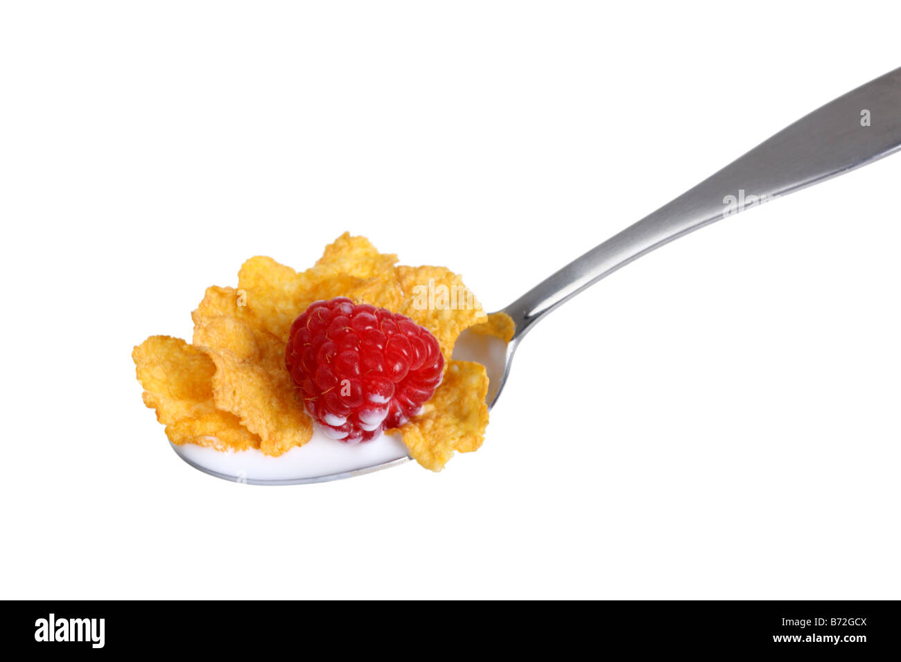 Spoon of cereal milk and raspberry cut out on white background Stock Photo