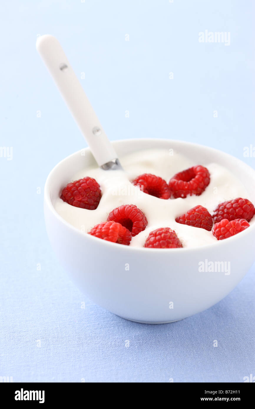Fresh berries and cream selective focus Stock Photo