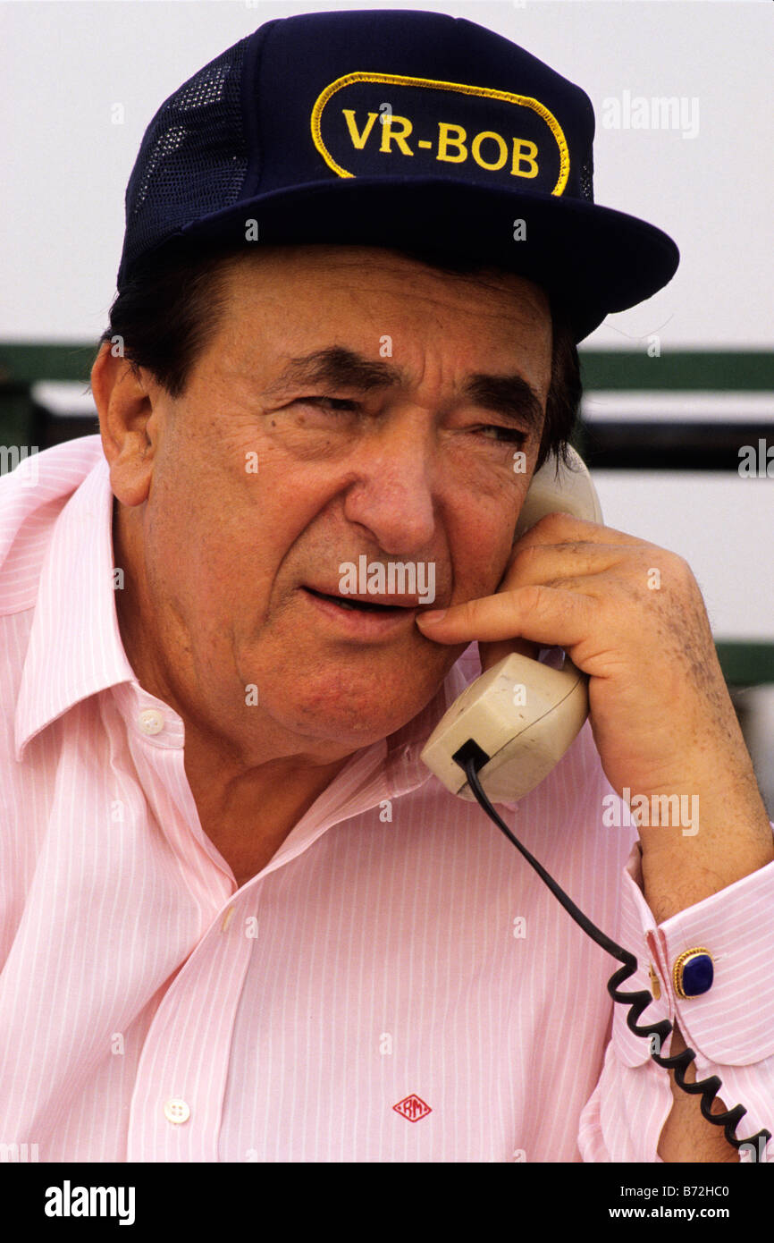 Robert Maxwell, media mogul, and owner of Mirror Group Newspapers,  talks on the phone his secretary on roof Stock Photo