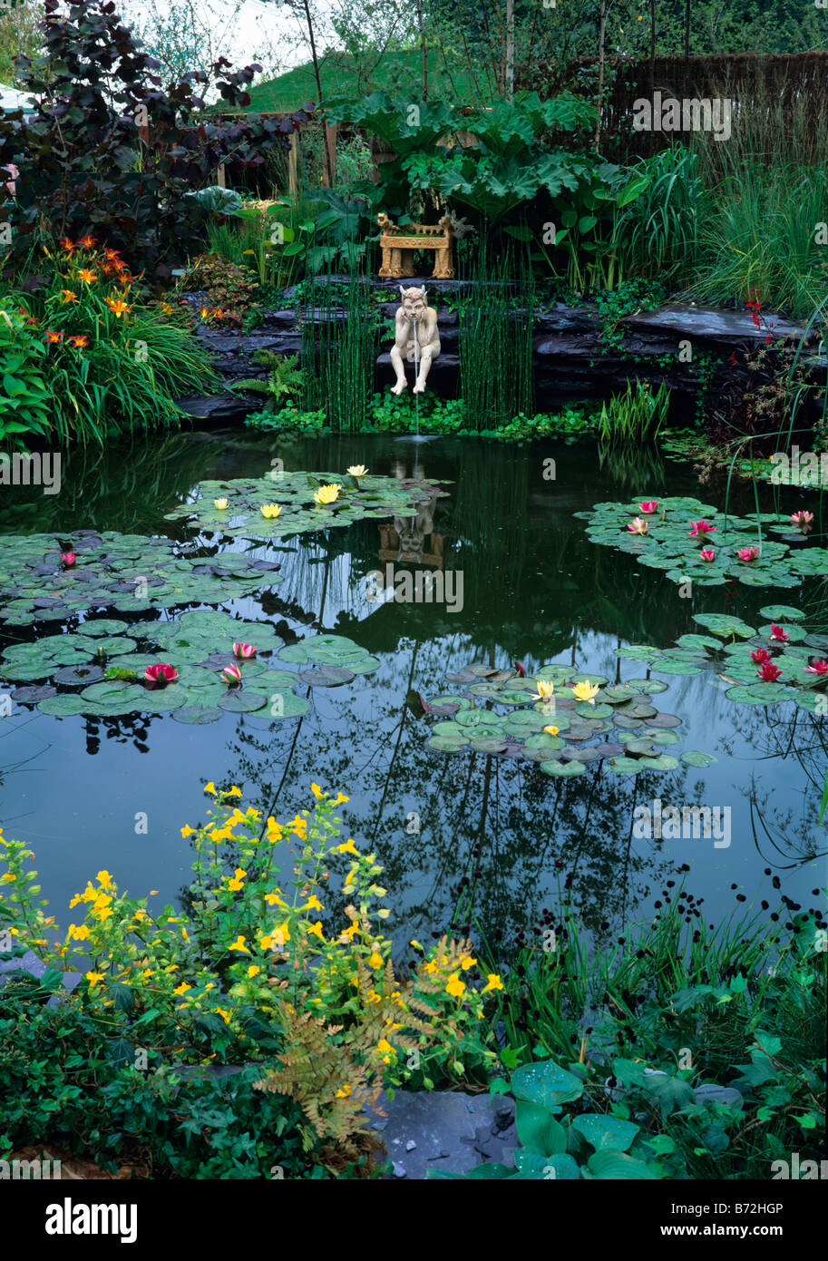 Water Lily pool with spouting figure Stock Photo