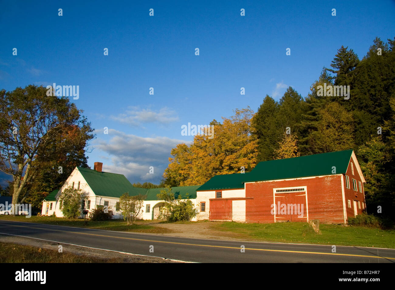Red barn and residential home in the town of Wentworth New Hampshire USA Stock Photo