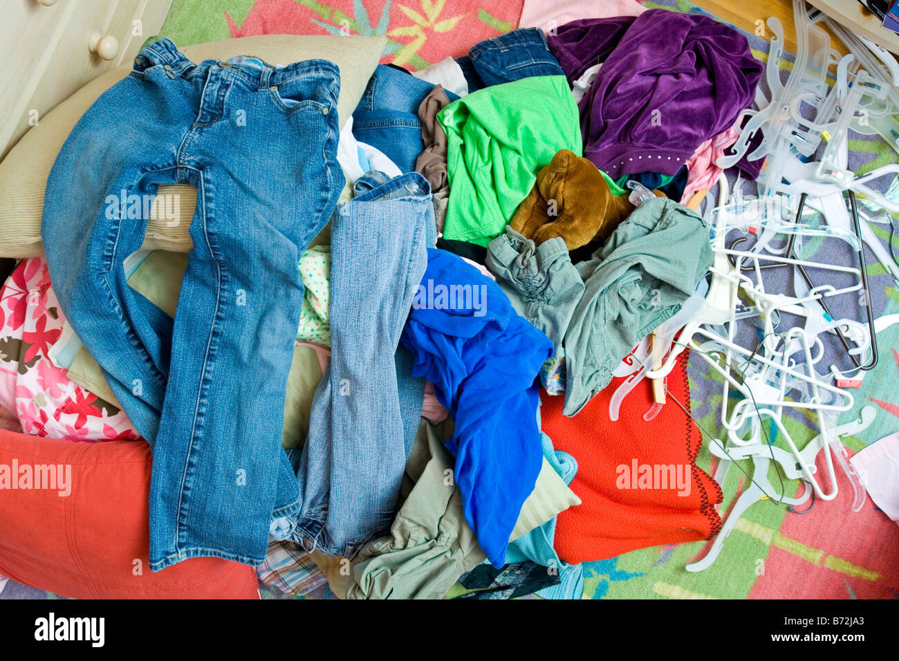 A pile of clothes on the floor in a teenager's bedroom Stock Photo - Alamy