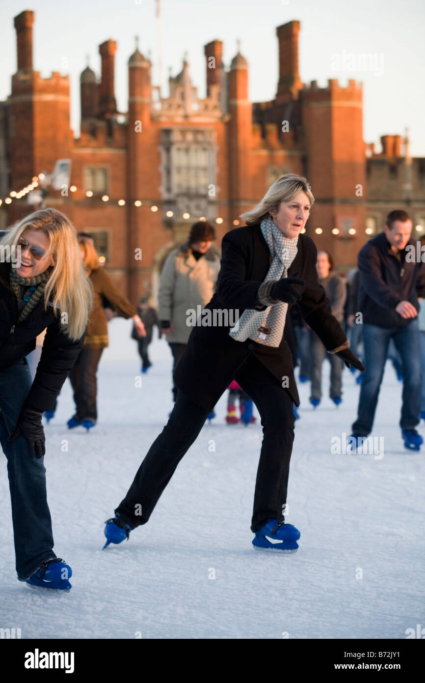 Woman ice skates at Hampton Court Palace ice rink. Hampton Court Palace. UK Stock Photo