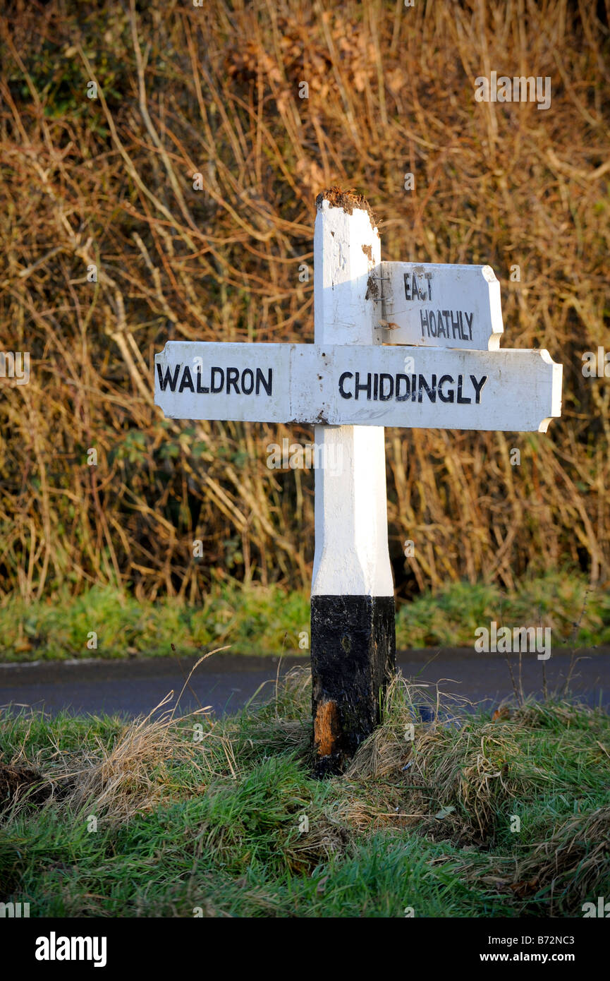 A damaged fingerpost sign which has been nailed back together by local residents. Picture by Jim Holden. Stock Photo