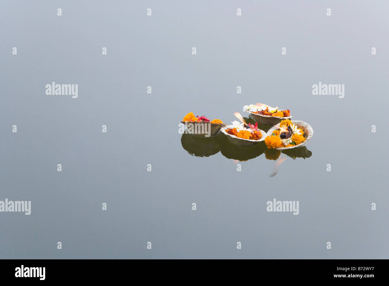 High angle view of religious offerings floating on water, Ganges River, Varanasi, Uttar Pradesh, India Stock Photo