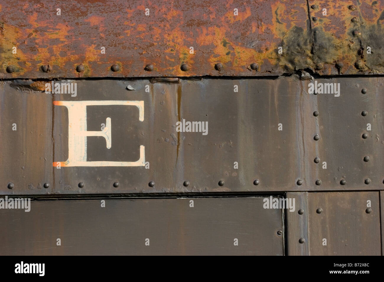 The letter E on the side of rusty old train car Stock Photo