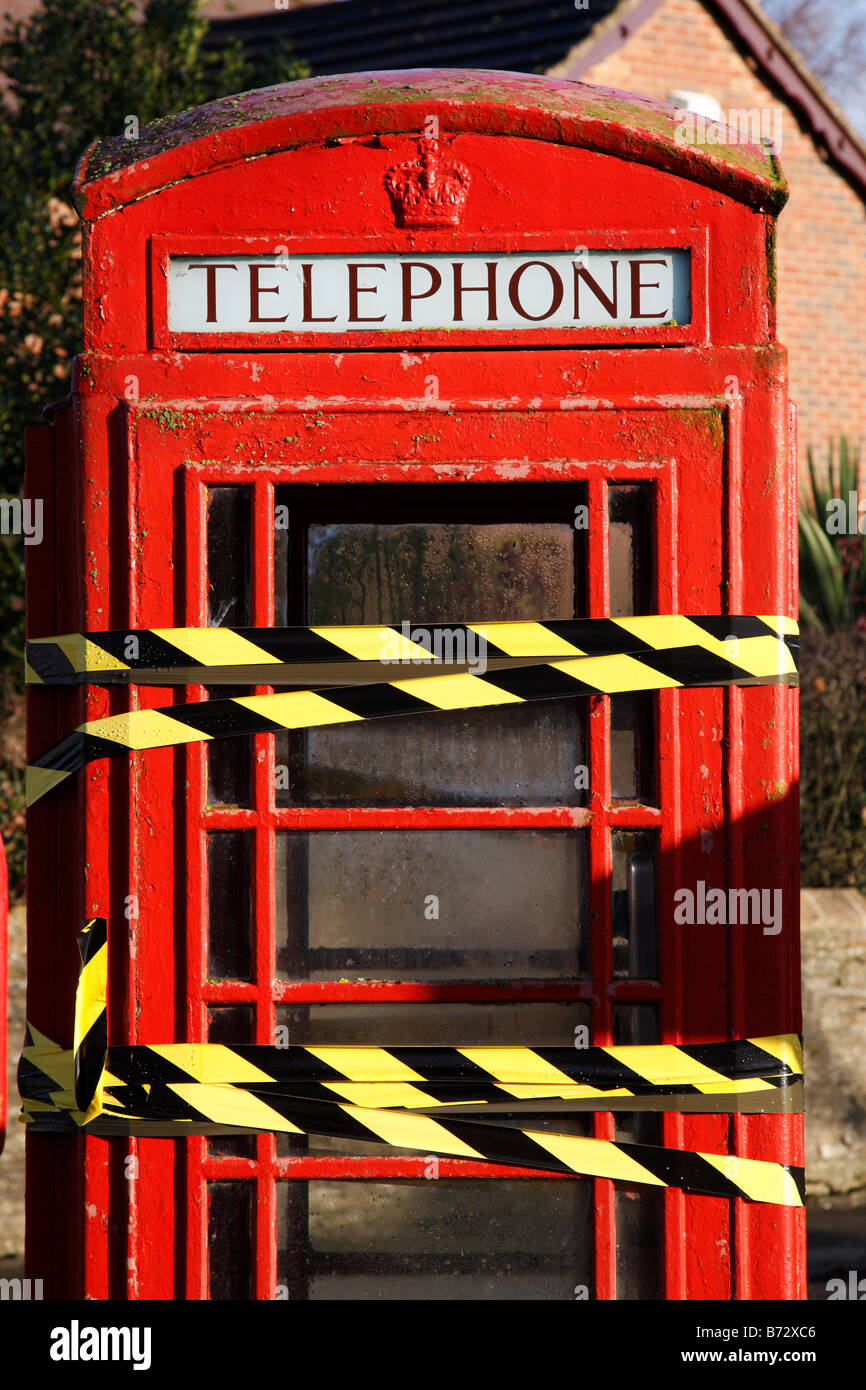 red telephone box taped up as out of order in the village of shackerstone leicestershire england uk Stock Photo