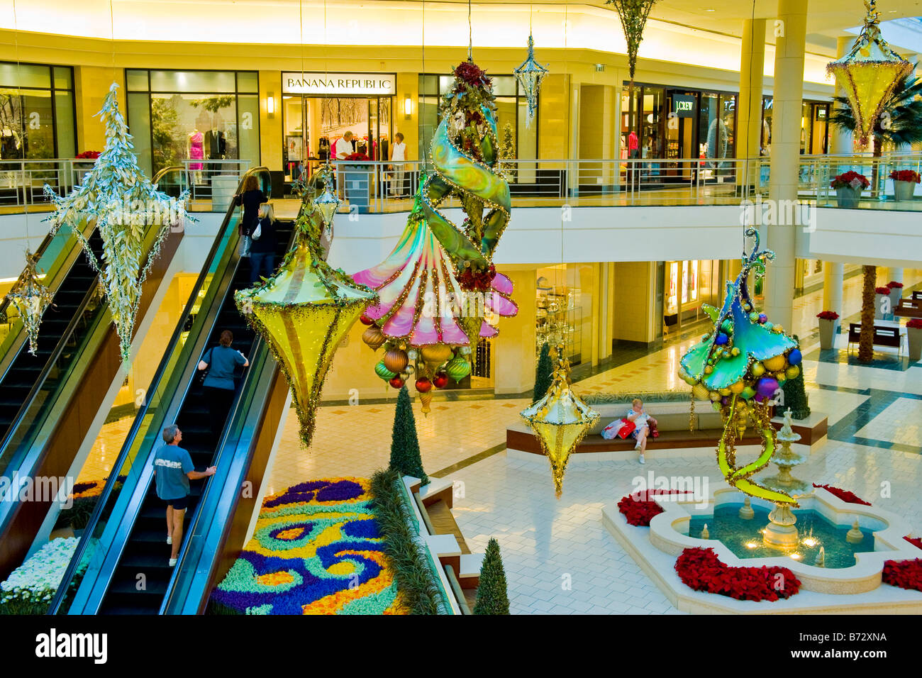 Gardens Shopping Mall or center Xmas decorations in central area by escalators , flower beds & fountains Stock Photo
