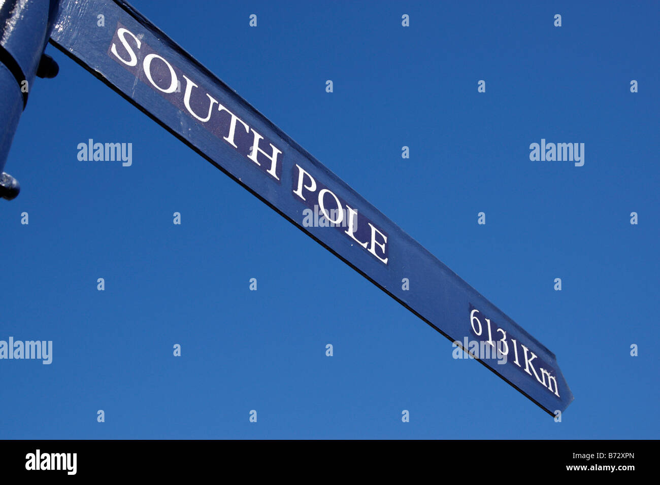 south pole distance displayed on a world signpost at the V&A waterfront cape town south africa Stock Photo